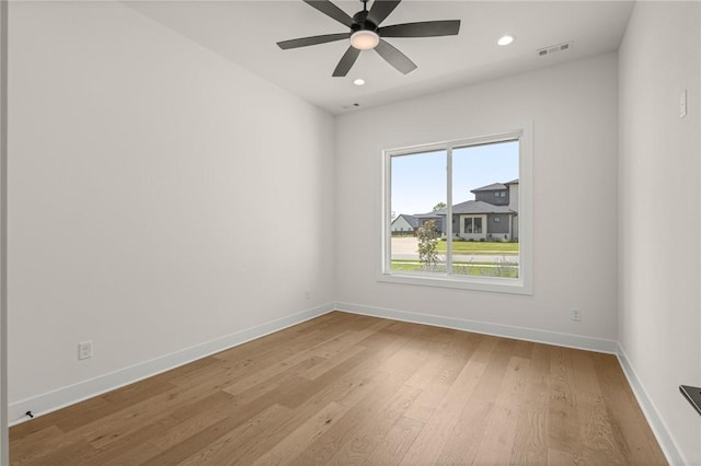 8607 W Feathered Nest Run, Bentonville, AR 72713 - unfurnished room featuring wood finished floors, recessed lighting, and a ceiling fan