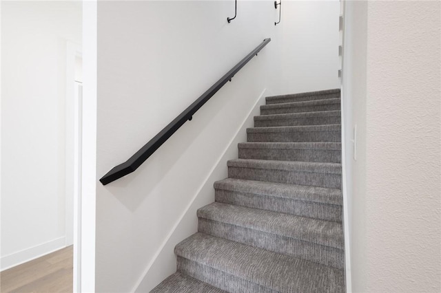 8607 W Feathered Nest Run, Bentonville, AR 72713 - stairway with wood finished floors