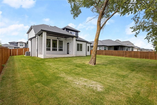 8607 W Feathered Nest Run, Bentonville, AR 72713 - back of house with a ceiling fan, a fenced backyard, brick siding, and roof with shingles