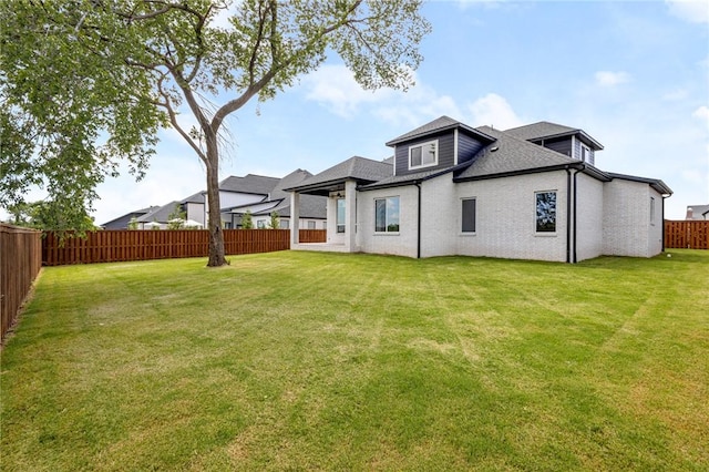 8607 W Feathered Nest Run, Bentonville, AR 72713 - rear view of property with a fenced backyard and roof with shingles
