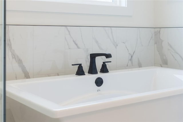 8607 W Feathered Nest Run, Bentonville, AR 72713 - bathroom with a bath