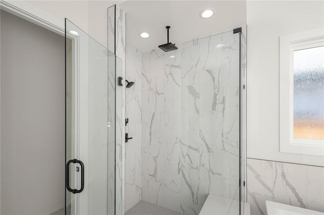 8607 W Feathered Nest Run, Bentonville, AR 72713 - bathroom featuring a marble finish shower and recessed lighting