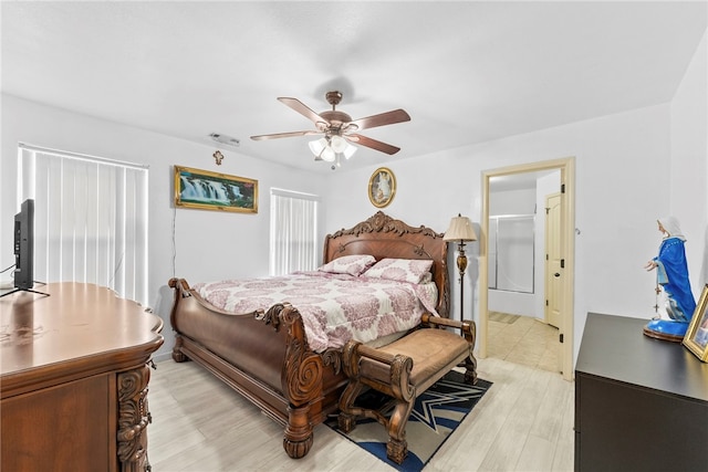 2302 12th Pl, Rogers, AR 72758 - bedroom with light wood-style flooring and ceiling fan