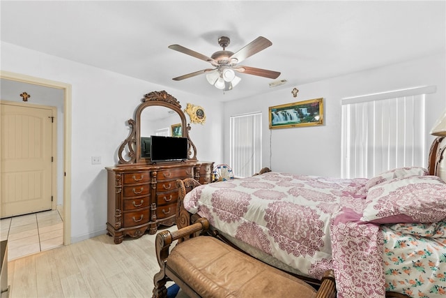 2302 12th Pl, Rogers, AR 72758 - bedroom featuring light wood-type flooring and ceiling fan