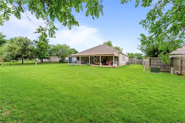2302 12th Pl, Rogers, AR 72758 - fenced backyard featuring a patio area