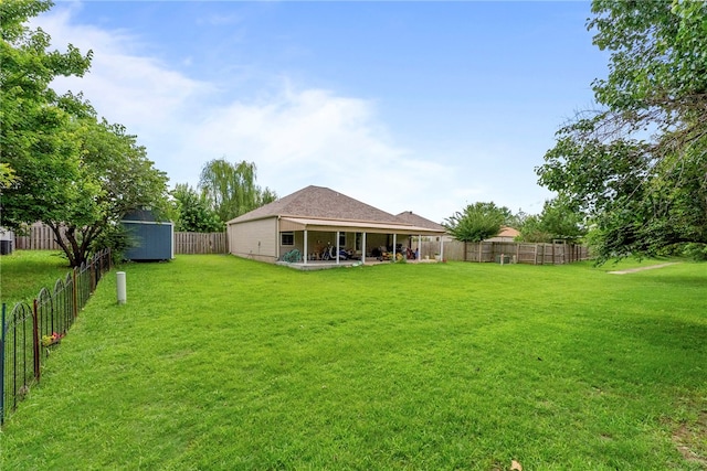 2302 12th Pl, Rogers, AR 72758 - fenced backyard with a patio