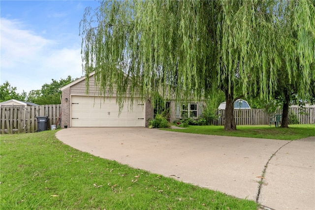 2302 12th Pl, Rogers, AR 72758 - obstructed view of property featuring brick siding, a garage, and driveway