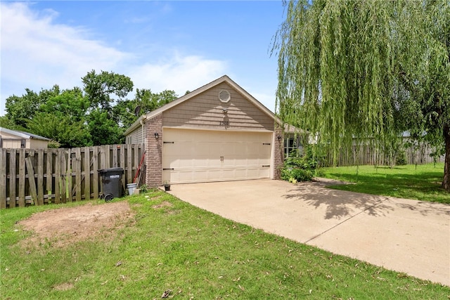 2302 12th Pl, Rogers, AR 72758 - view of home's exterior featuring brick siding and a garage
