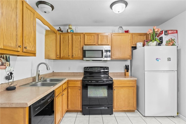 2302 12th Pl, Rogers, AR 72758 - kitchen with black appliances, light countertops, and light tile patterned flooring