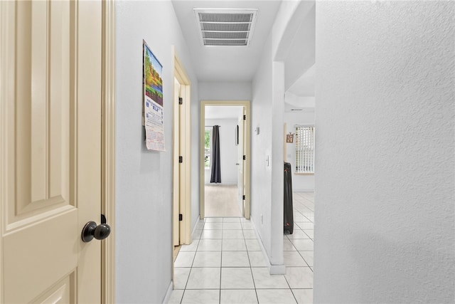 2302 12th Pl, Rogers, AR 72758 - hall with light tile patterned flooring and a textured wall