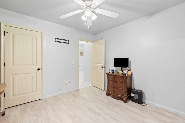 2302 12th Pl, Rogers, AR 72758 - bedroom featuring wood finished floors and a ceiling fan