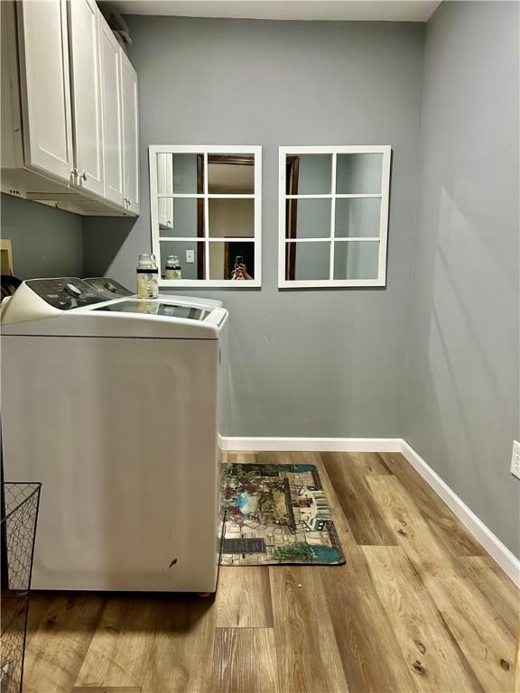 3383 Sr 164 E, Dover, AR 72837 - washroom featuring cabinet space, wood finished floors, and washer and clothes dryer