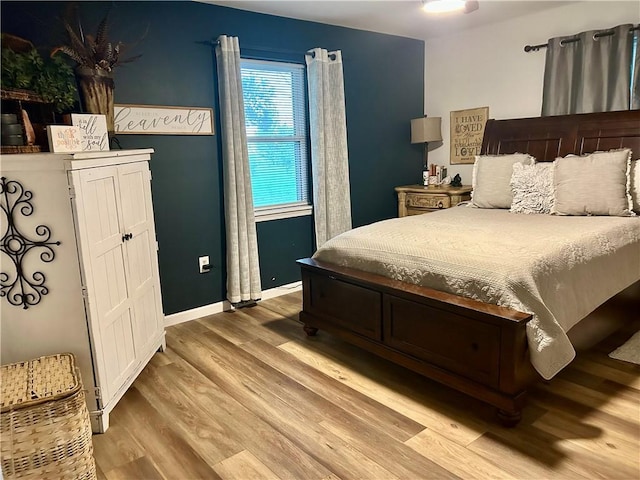 3383 Sr 164 E, Dover, AR 72837 - bedroom with wood finished floors and baseboards