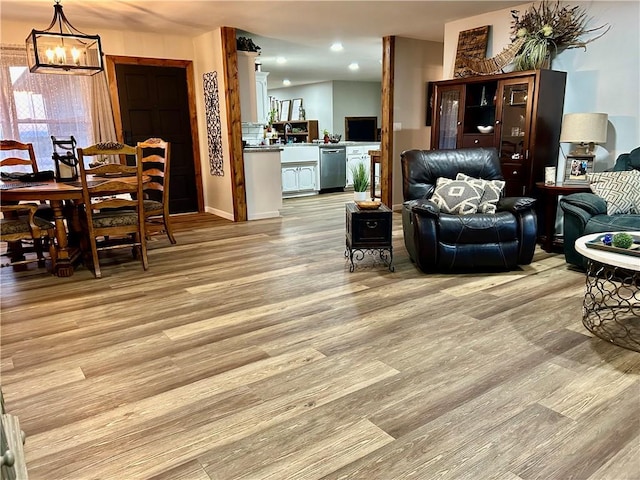 3383 Sr 164 E, Dover, AR 72837 - living room featuring light wood-style floors and a chandelier
