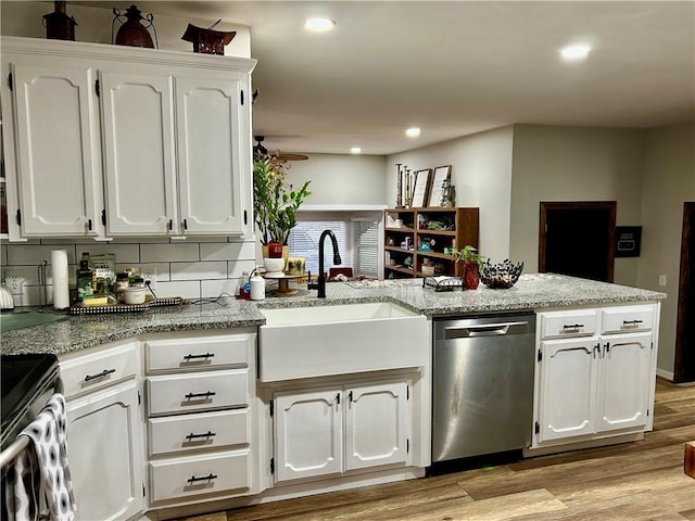 3383 Sr 164 E, Dover, AR 72837 - kitchen featuring dishwasher, a peninsula, black electric range, white cabinetry, and light wood finished floors