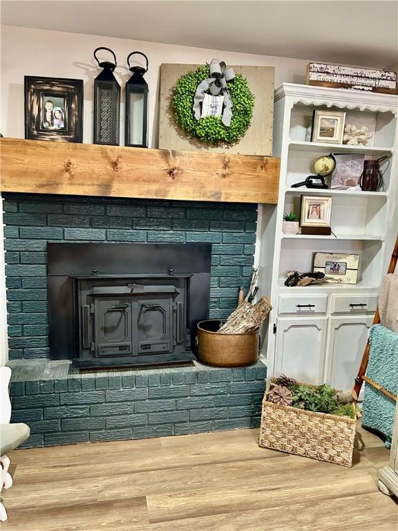 3383 Sr 164 E, Dover, AR 72837 - detailed view of wood finished floors and a wood stove