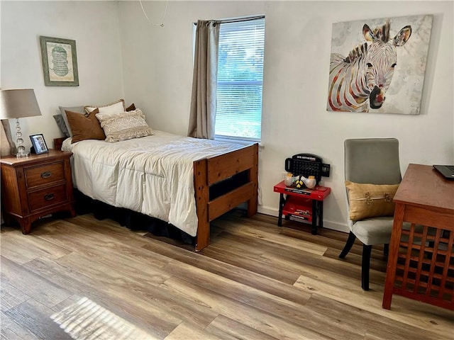 3383 Sr 164 E, Dover, AR 72837 - bedroom featuring light wood-style floors and baseboards