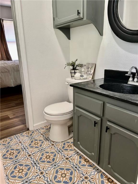 3383 Sr 164 E, Dover, AR 72837 - half bath featuring vanity, ensuite bath, and tile patterned floors