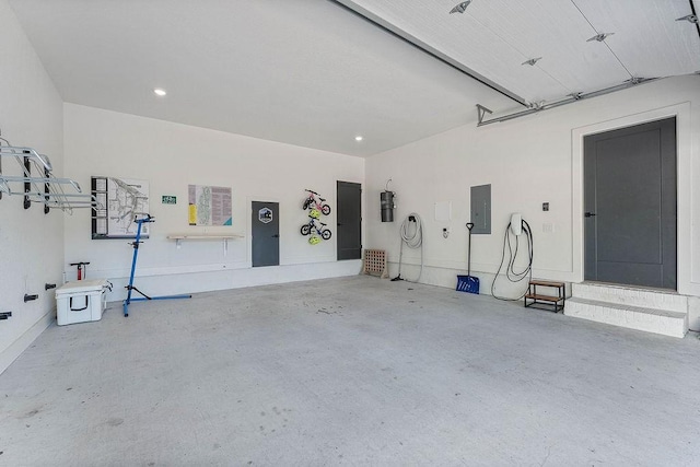 103 NW Ozark Way, Bentonville, AR 72712 - garage featuring recessed lighting and electric panel