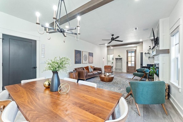 103 NW Ozark Way, Bentonville, AR 72712 - dining space with wood finished floors, a ceiling fan, and a chandelier