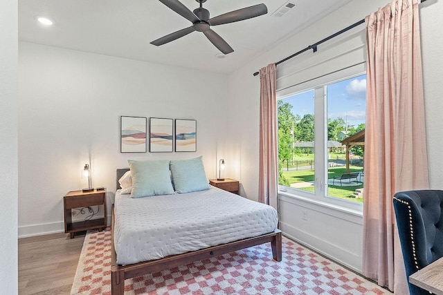 103 NW Ozark Way, Bentonville, AR 72712 - bedroom featuring multiple windows, wood finished floors, ceiling fan, and recessed lighting