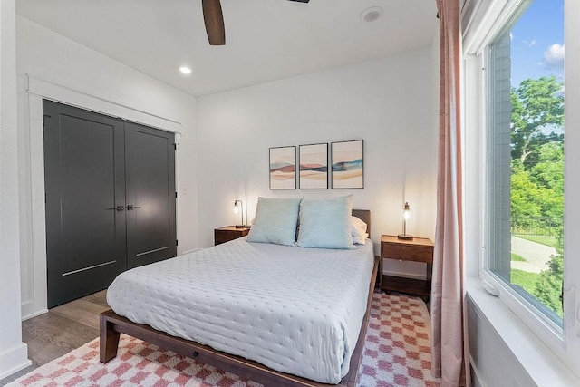 103 NW Ozark Way, Bentonville, AR 72712 - bedroom with wood finished floors, ceiling fan, and recessed lighting