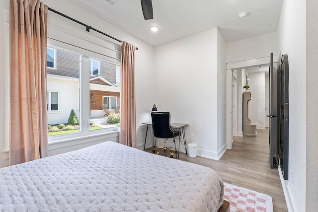 103 NW Ozark Way, Bentonville, AR 72712 - bedroom with wood finished floors and ceiling fan