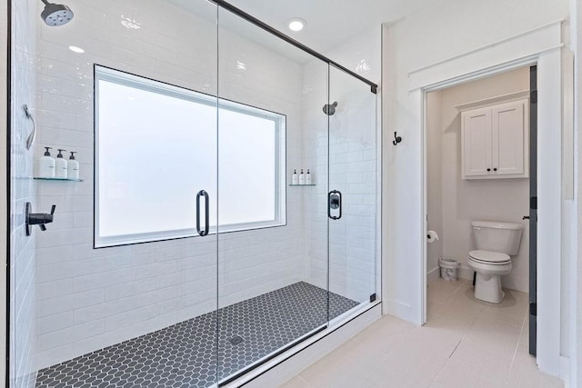 103 NW Ozark Way, Bentonville, AR 72712 - bathroom with a shower stall and tile patterned floors