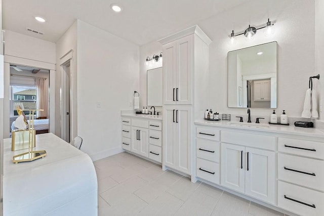 103 NW Ozark Way, Bentonville, AR 72712 - bathroom with two vanities, tile patterned flooring, recessed lighting, and ensuite bath