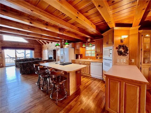 31 Table Rock Dr, Holiday Island, AR 72631 - kitchen featuring white appliances, a fireplace, light wood-type flooring, a wooden ceiling with exposed beams, and light countertops