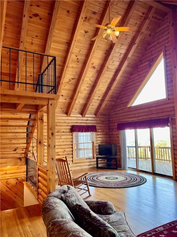 31 Table Rock Dr, Holiday Island, AR 72631 - living room with high vaulted ceiling, a wood ceiling with exposed beams, healthy amount of natural light, hardwood / wood-style floors, and ceiling fan
