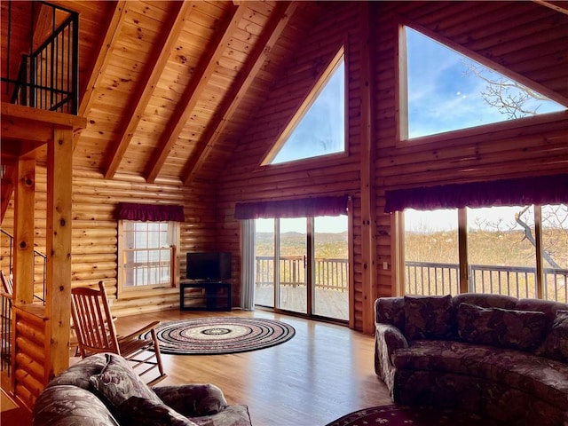 31 Table Rock Dr, Holiday Island, AR 72631 - living room featuring high vaulted ceiling, wood finished floors, a wooden ceiling with exposed beams, and rustic walls