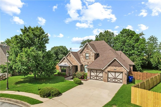 4130 Willowbend Dr, Rogers, AR 72758 - view of front of home featuring driveway, a garage, brick siding, and stone siding
