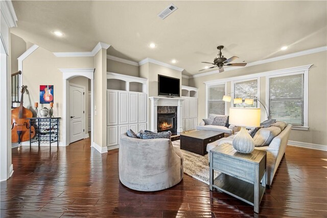 4130 Willowbend Dr, Rogers, AR 72758 - living room featuring a glass covered fireplace, ceiling fan, dark wood-style flooring, crown molding, and recessed lighting