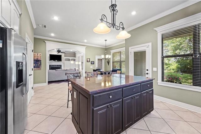 4130 Willowbend Dr, Rogers, AR 72758 - kitchen with stainless steel refrigerator with ice dispenser, ceiling fan, light tile patterned floors, plenty of natural light, and crown molding