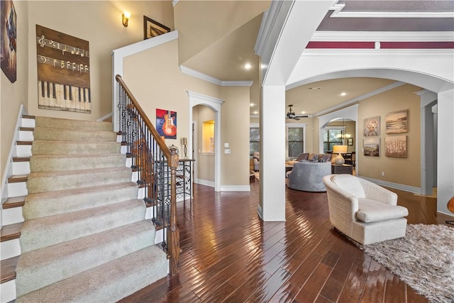 4130 Willowbend Dr, Rogers, AR 72758 - entrance foyer with ornamental molding, arched walkways, hardwood / wood-style flooring, stairway, and a ceiling fan