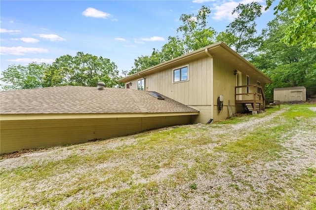 8394 Admiral Nimitz Dr, Rogers, AR 72756 - view of side of home featuring a storage shed