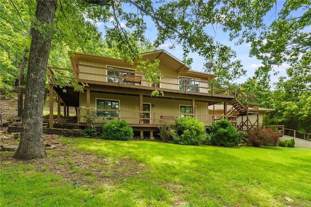 8394 Admiral Nimitz Dr, Rogers, AR 72756 - back of property featuring a lawn, a deck, and stairs