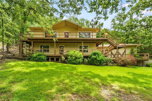 8394 Admiral Nimitz Dr, Rogers, AR 72756 - back of property with a deck, a lawn, and stairs