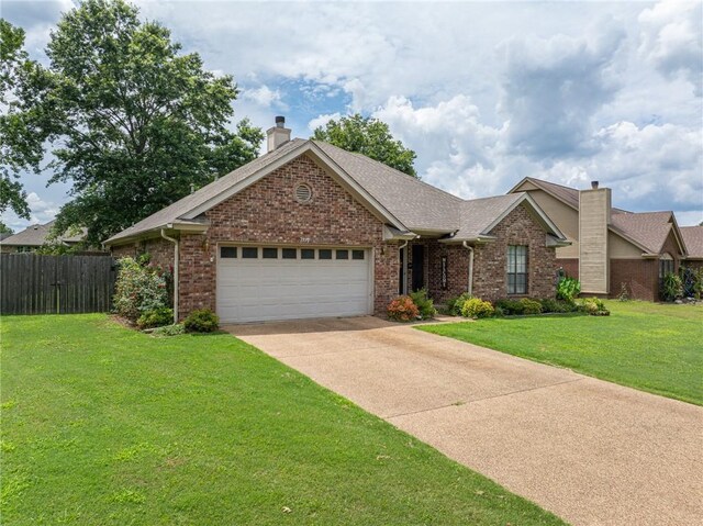 2105 Brookhaven Dr, Alma, AR 72921 - single story home featuring a chimney, brick siding, an attached garage, and driveway