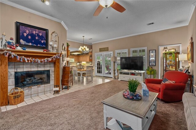 2105 Brookhaven Dr, Alma, AR 72921 - carpeted living area with a ceiling fan, a textured ceiling, ornamental molding, tile patterned floors, and a chandelier