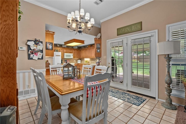 2105 Brookhaven Dr, Alma, AR 72921 - dining area with ornamental molding, a chandelier, and light tile patterned floors