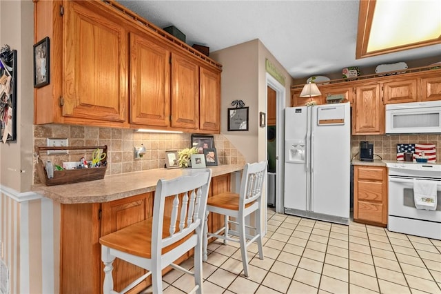 2105 Brookhaven Dr, Alma, AR 72921 - kitchen with white appliances, light countertops, decorative backsplash, light tile patterned floors, and brown cabinetry