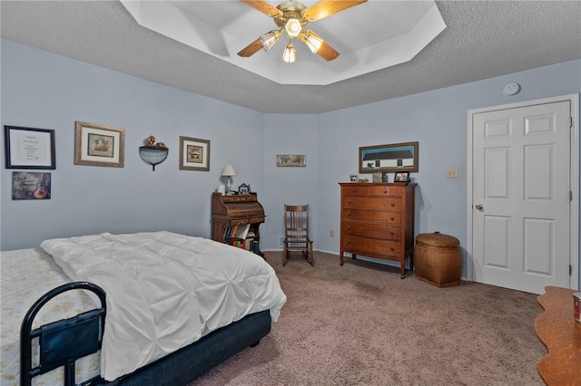 2105 Brookhaven Dr, Alma, AR 72921 - carpeted bedroom featuring ceiling fan, a raised ceiling, and a textured ceiling