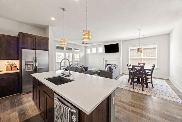 1428 Allens Mill Way, Cave Springs, AR 72718 - kitchen featuring appliances with stainless steel finishes, dark brown cabinets, dark wood finished floors, hanging light fixtures, and recessed lighting