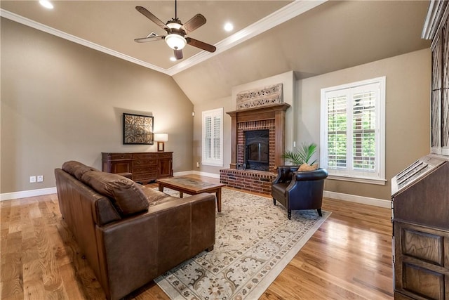 348 Whitcliff Dr, Cave Springs, AR 72718 - living room with a ceiling fan, light wood-style flooring, a brick fireplace, crown molding, and lofted ceiling