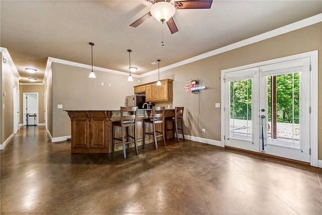 348 Whitcliff Dr, Cave Springs, AR 72718 - kitchen with ornamental molding, freestanding refrigerator, concrete flooring, ceiling fan, and a kitchen breakfast bar