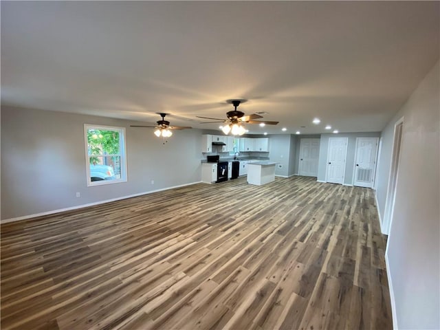 21 S Elizabeth St, Dover, AR 72837 - unfurnished living room with recessed lighting, dark wood-type flooring, and ceiling fan
