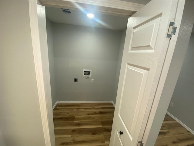 21 S Elizabeth St, Dover, AR 72837 - washroom featuring light wood-style floors, hookup for a washing machine, and electric dryer hookup