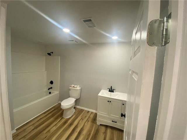 21 S Elizabeth St, Dover, AR 72837 - bathroom featuring wood finished floors, vanity, shower / bath combination, and recessed lighting